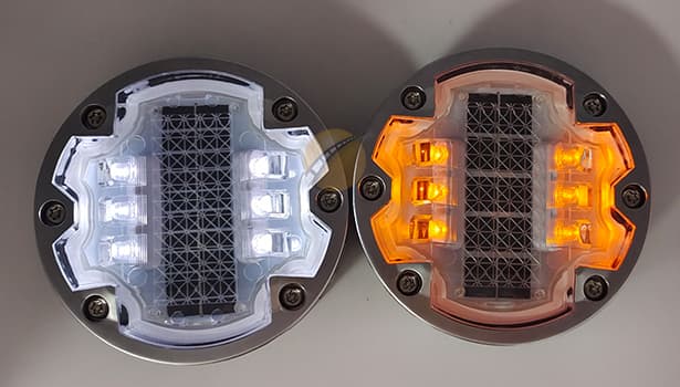 Embedded-type solar road studs installed on urban zebra crossings, featuring red/yellow constant light + sensor-triggered flashing to warn vehicles, ensuring pedestrian safety while maintaining road driving smoothness