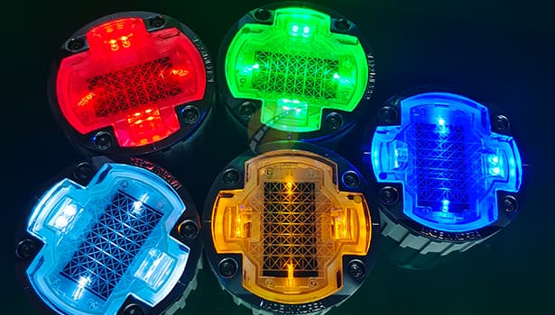 Smart solar road studs with vehicle approach sensing (microwave/infrared), auto-brightness adjustment, remote battery power monitoring, and fault alarm, integrated with intelligent traffic systems (traffic lights/cameras)