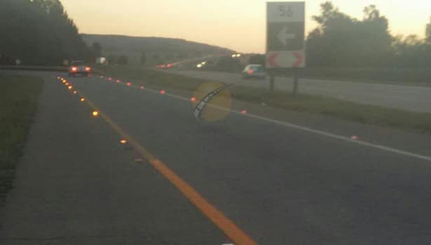 Solar road studs installed on a highway in a developing country during dusk