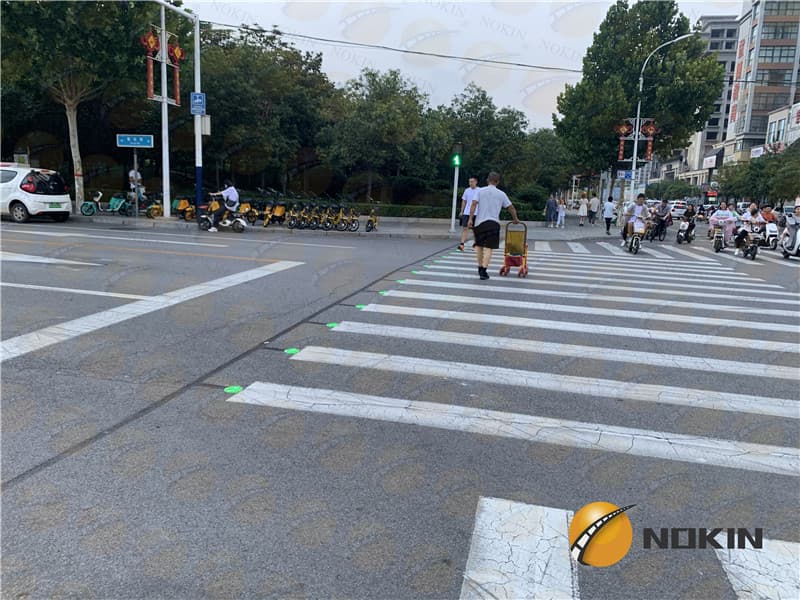 In roadway warning lights at crosswalks