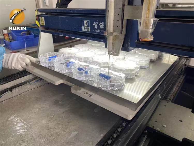 Glue injection and curing for solar road stud lights